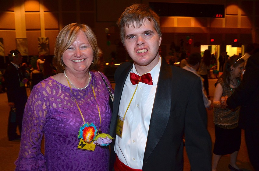 Dorri McPherson and her son, Dylan, share laughs on the dance floor.