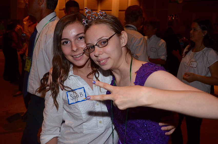 Volunteer Sara Meadow and Ayla Banter dance together.