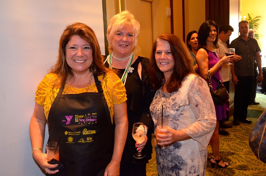 Annette Gueli, Maribeth Phillips and Donna Messina toast to a fun night of food and friends.