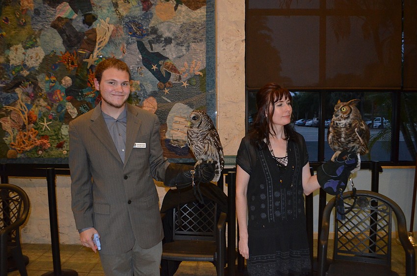 Jonathan Hande, with Nova, a barred owl, and Tara Morningstar with Gatsby, a great horned owl