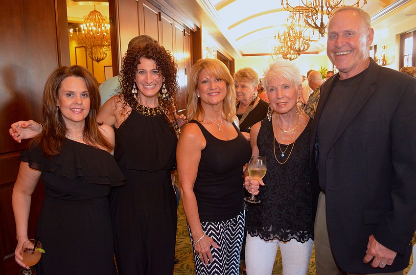 Tina Wahlers, Hollie Parks, Bev Kinder, Janet Albright and Jim Stoup dress for the occasion, in comfortable and formal wear.