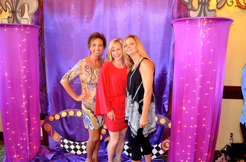 Andrea Welter, Jennifer Colombo and Amy Jendro show off their sassy sides for a photo opp.