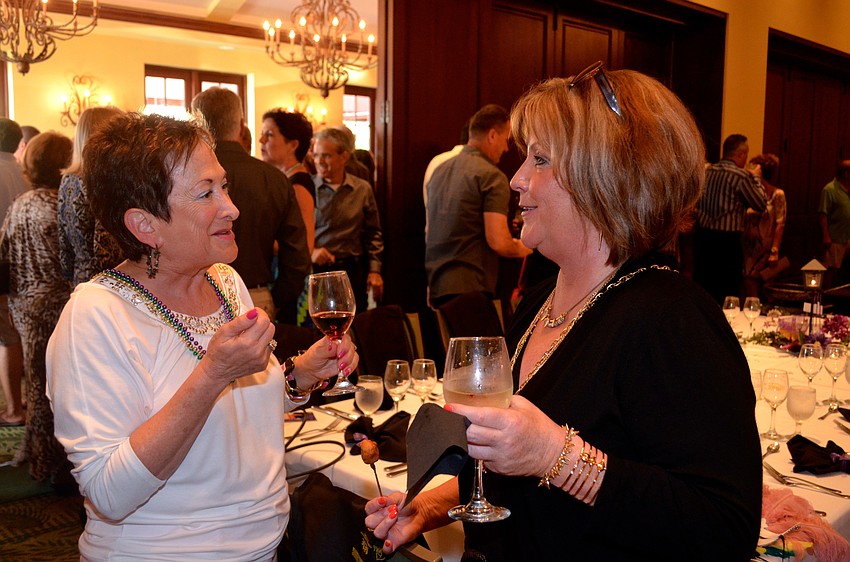Barbara Zdziarski and Lisa O’Leary share laughs before they get their aprons dirty.