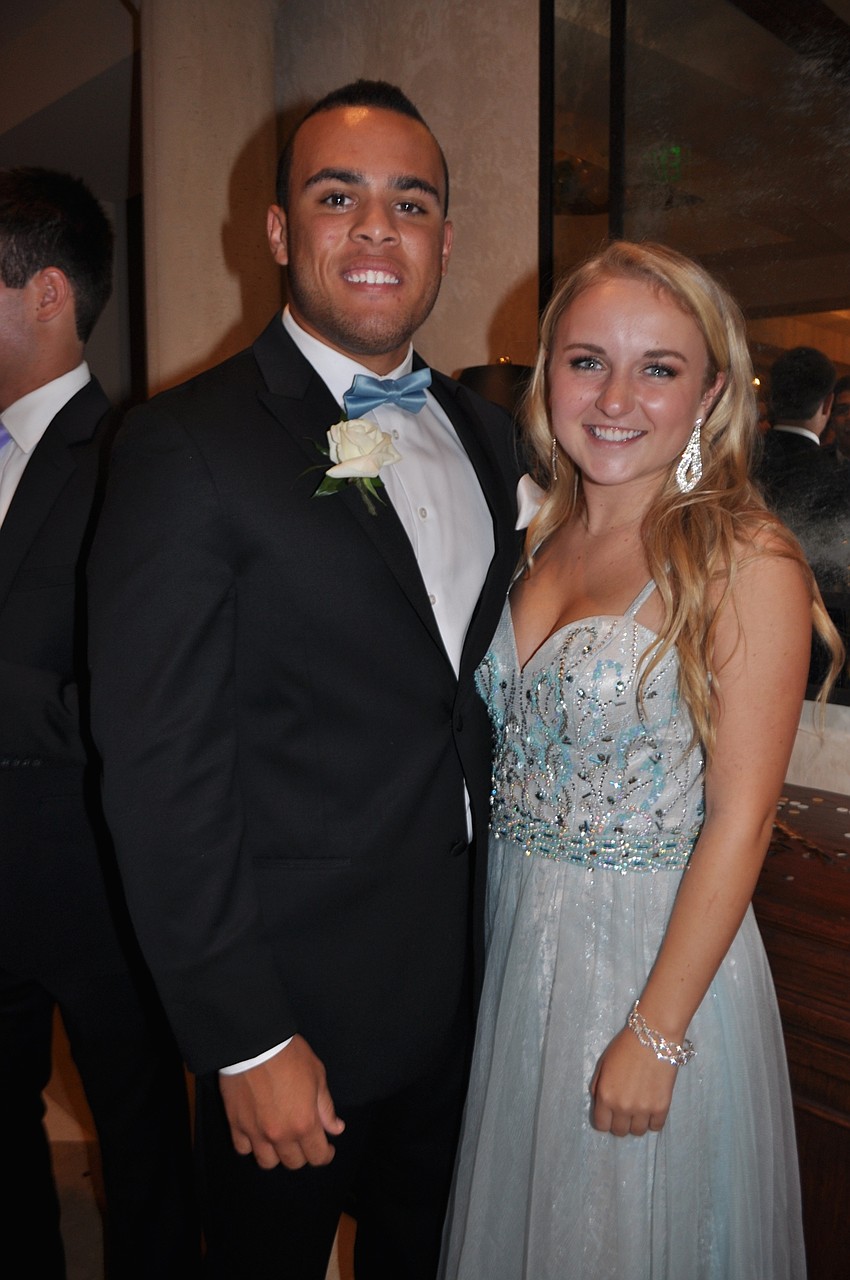 Senior Desmond Lindsay brings sophomore Greta Holland.