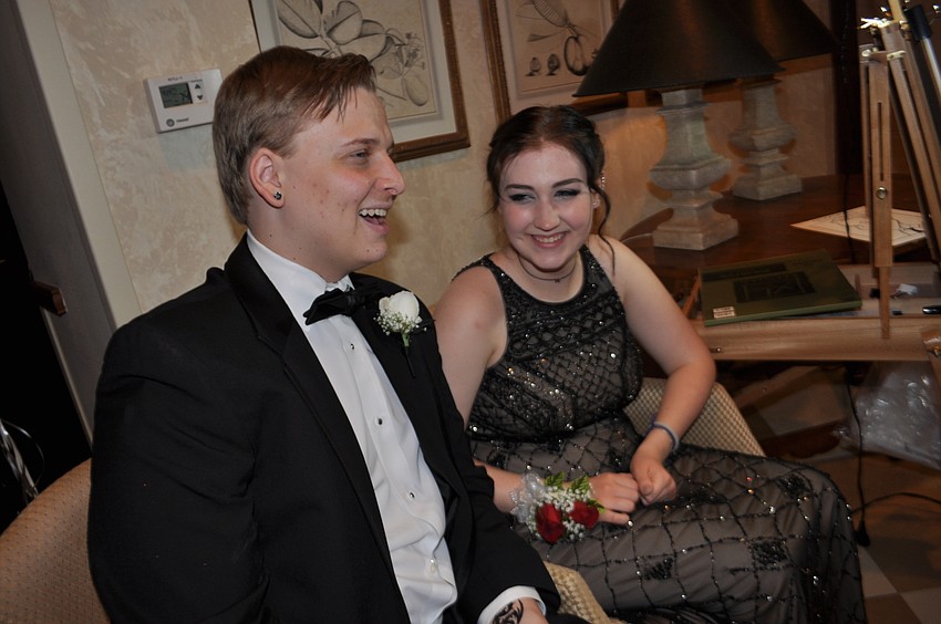 Noah Blumenthal and Katie Young chat as they have their caricature drawn.