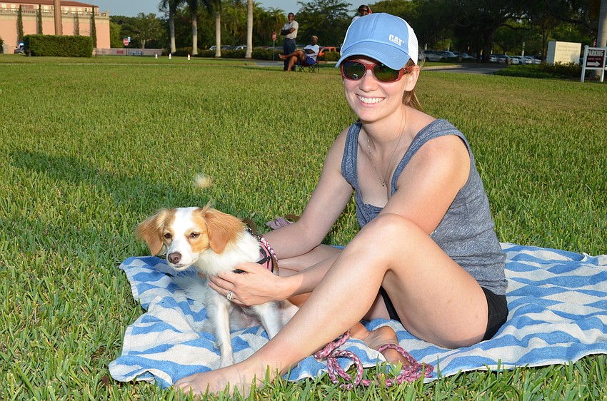 Missy Perdue watches the race with her dog Lola.