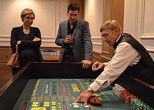 Carly and Daniel Brown listen to the rules before playing with Andy Branco.