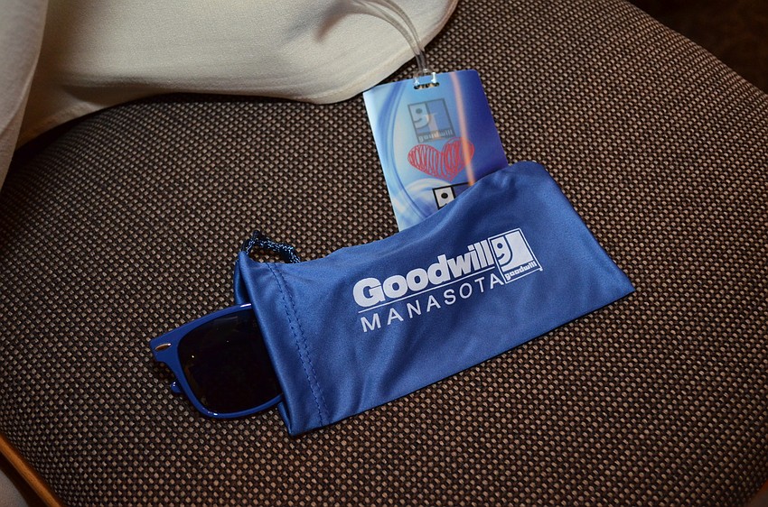 Guests found blue sunglasses as a favor on their seats.