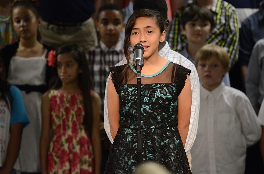 Adriana Guerra speaks to the audience about the history of Florida.