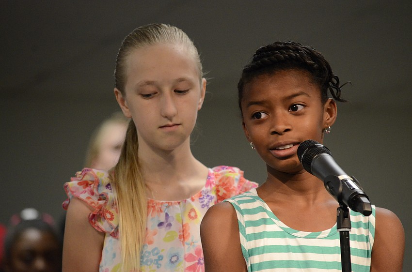 Rouasia Bundrage tells the audience about the history of the state, which is a subject of fourth grade.
