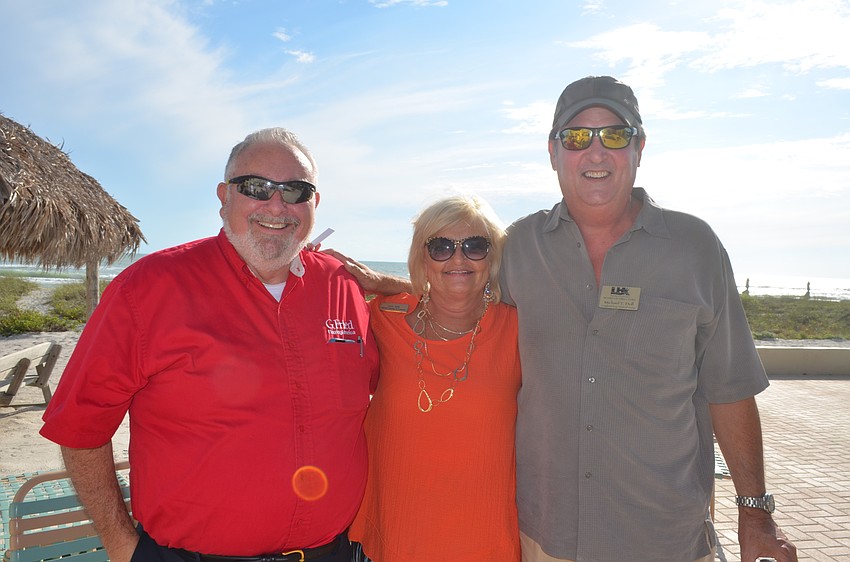 Jack Dean, of G. Fried FlooringAmerica, Laura Jaret, of Michael Saunders & Company, and Michael Doll, of Longboat Key Financial Group