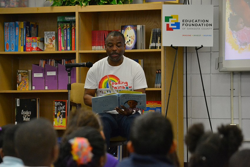 Host of Reading Rainbow LeVar Burton reads one of his favorite books “Amazing Grace” to students.