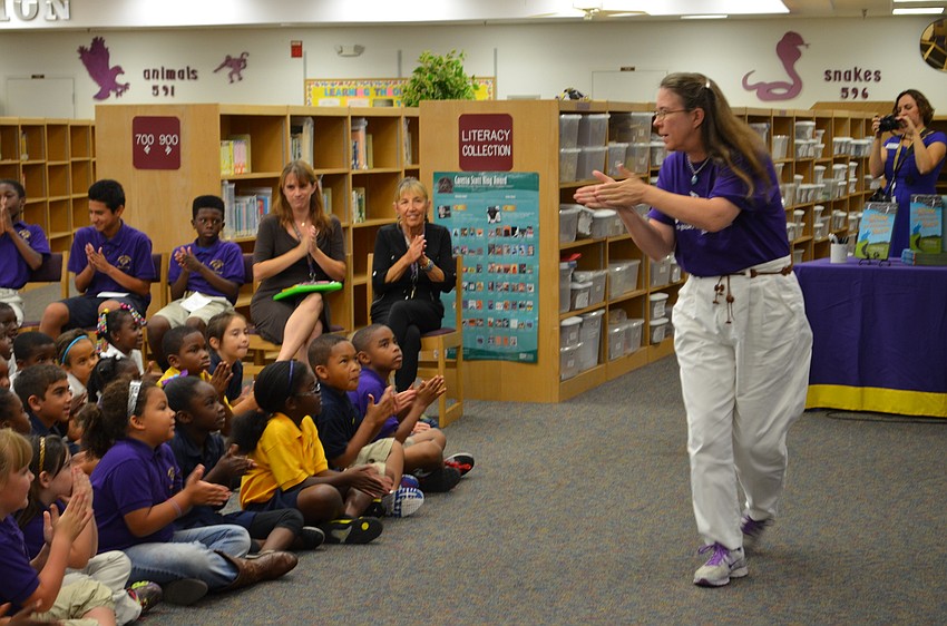 Debbie Mondale of Kindermusik teaches student how to make sounds with their hands.