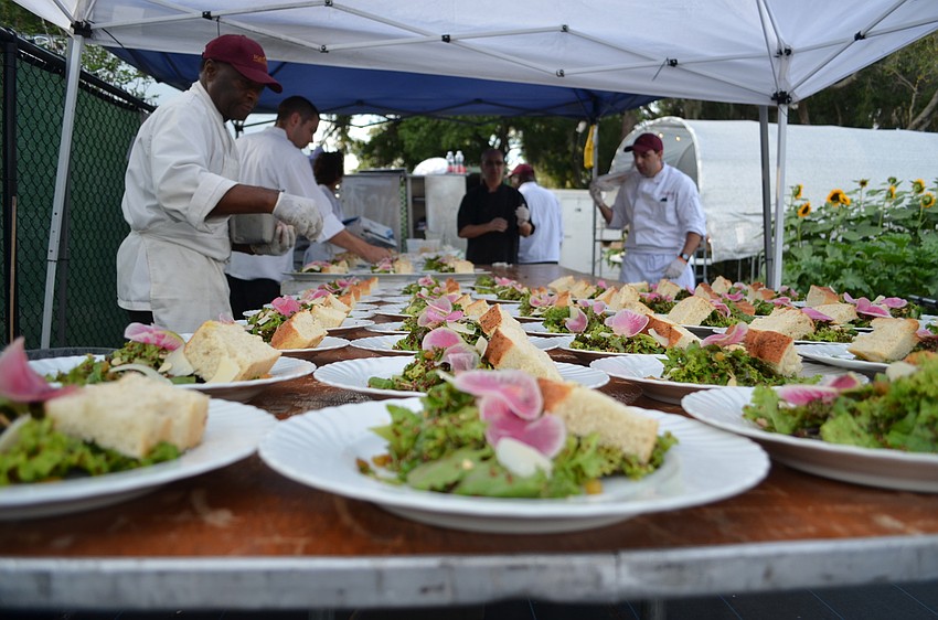 The Mattison’s staff prepare the large dinner party’s salads.
