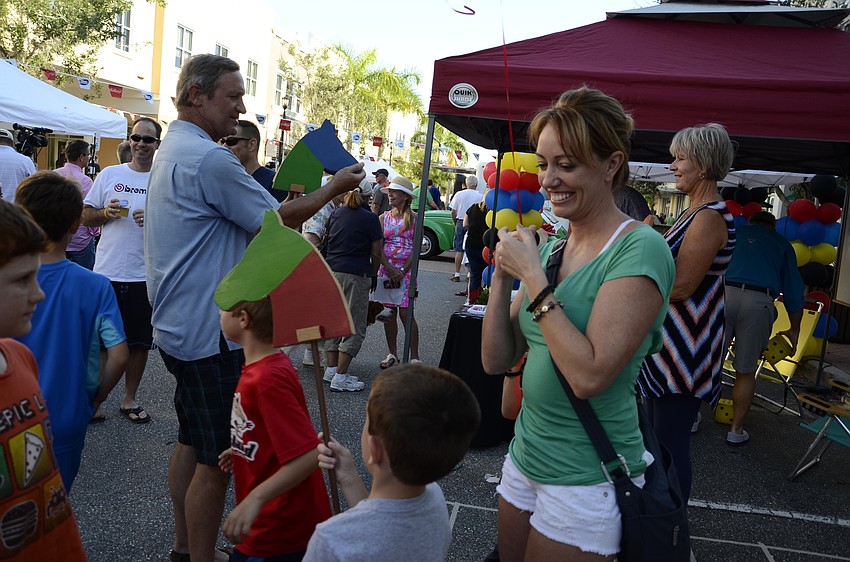 Tara Cocco plays a horse race game with Center for Building Hope.
