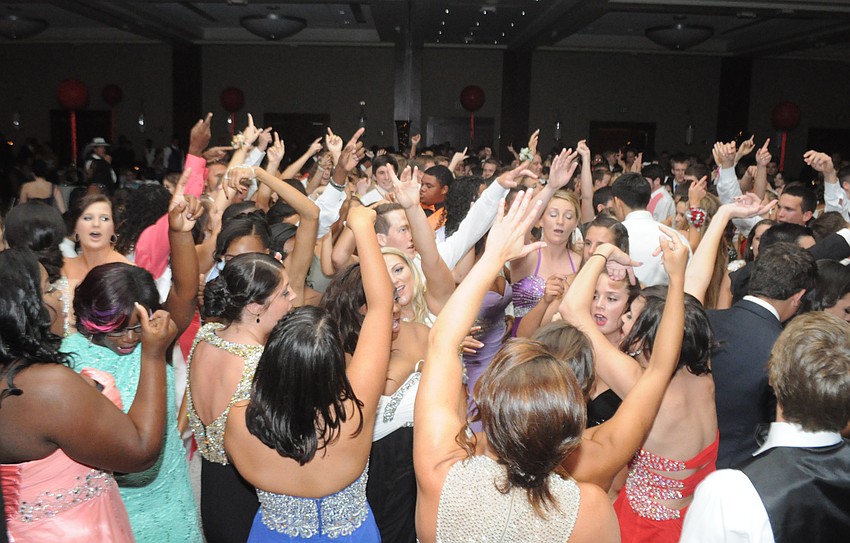 Students sing along on the dance floor.
