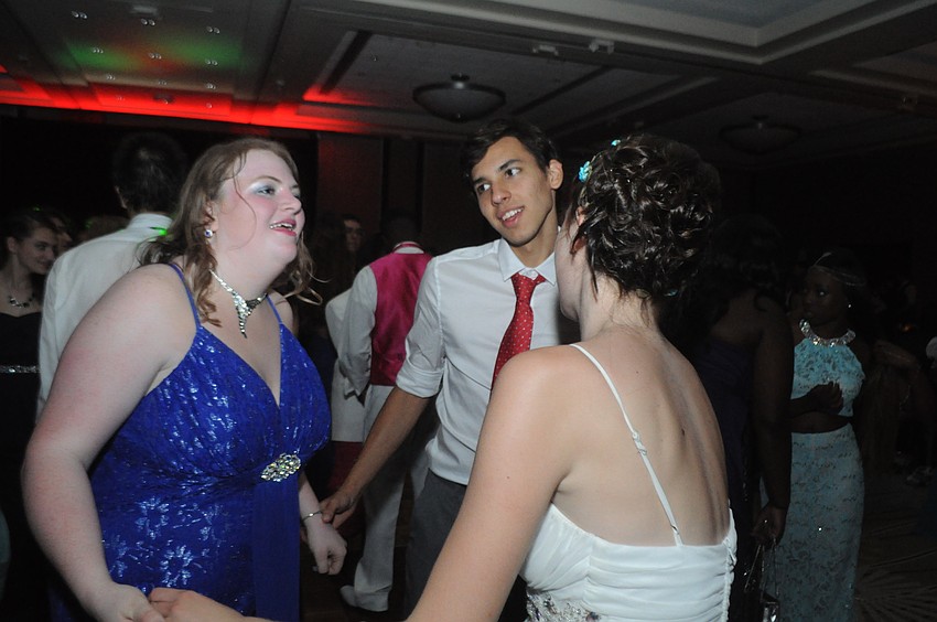 Dara Cottrel, Alexander Rodriguez Nikitina and Emeli Dennin rock out at prom.