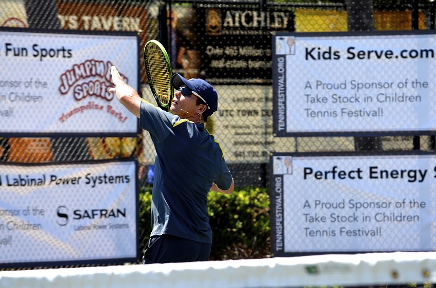Claudiu Retean, 36, focuses on smacking the ball during match No. 1 of the Pros versus Prodigies event.