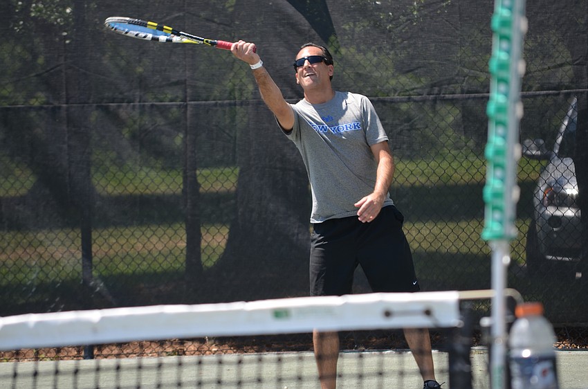 Howie Ash tests his serving speed.