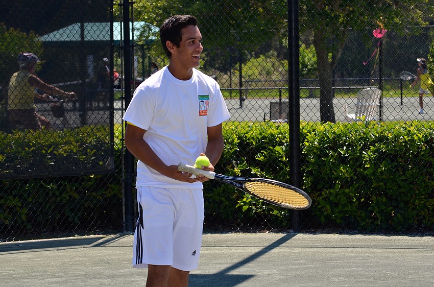 A baseball player who doesn’t play much tennis, Giancarlo Gamboa-Barrios tests his serving speed.