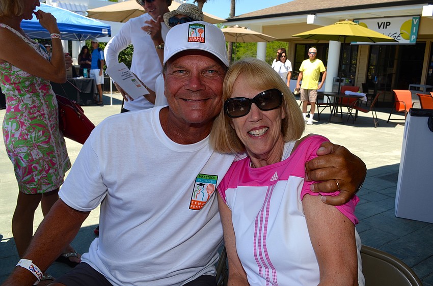 Paul Tradelius and Mary Rice enjoy tennis matches from the stands.