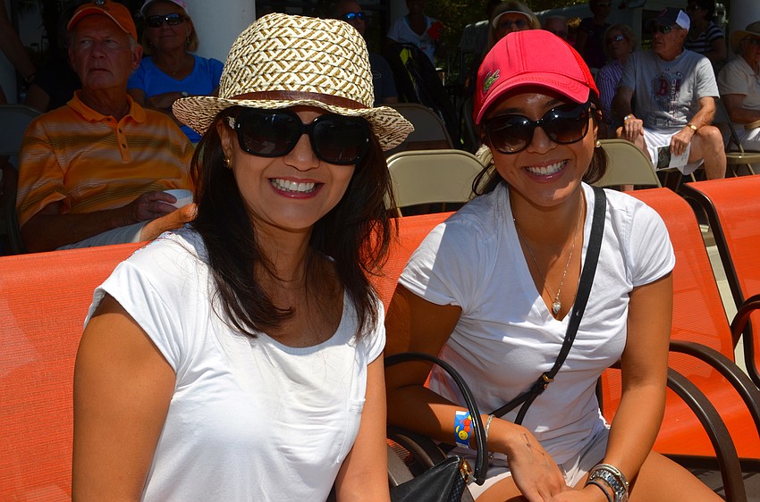 Katia Taba and Stephanie Tominga stay cool in shorts and with sunglasses.
