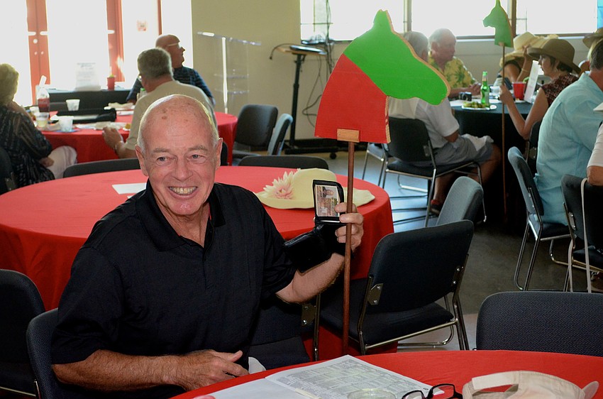 John McDermott roots for a horse named “Whiskey Runner.”