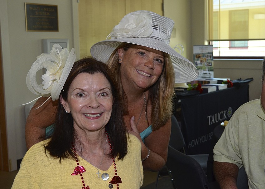 Patty Sileo and Kate Shaver chose light colored, smaller hats for the Derby event.