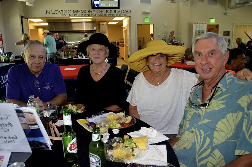 — John and Marijke Sims, Dee Ann Blake and Charles Fischer enjoy watching the annual Derby event, which dates back to 1875.
