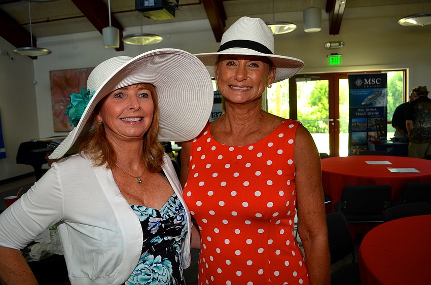 Cathi Thomaides and Linda Ozley show off their Kentucky Derby attire.