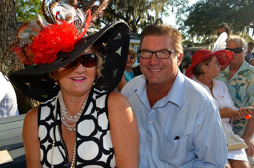 Paula Daughtery, beside her husband, Tim, has one of the biggest and most decorative hats at the event.