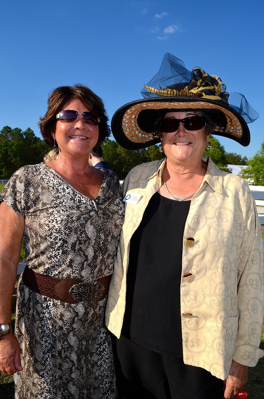 Gal pals Vicki De Leon and Melissa Spillenkothen show off their Derby attire, hats and all.