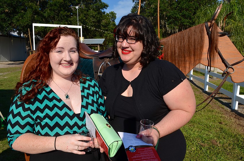 Katie Eccles and Anna Schirripa wait for cold drinks.