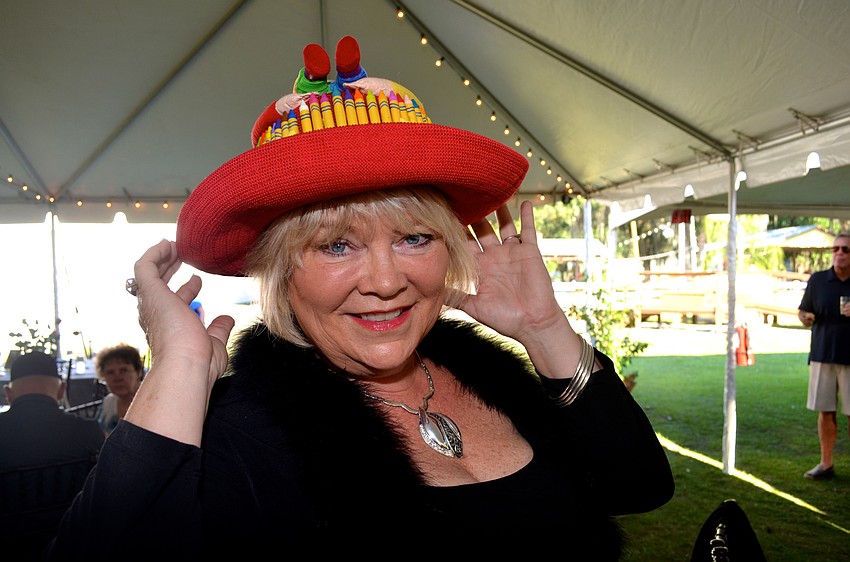Betsy Plante, of Blessing Bags of Bradenton, shows off a crayon-covered hat, which symbolizes the supplies her organization provides for homeless children.