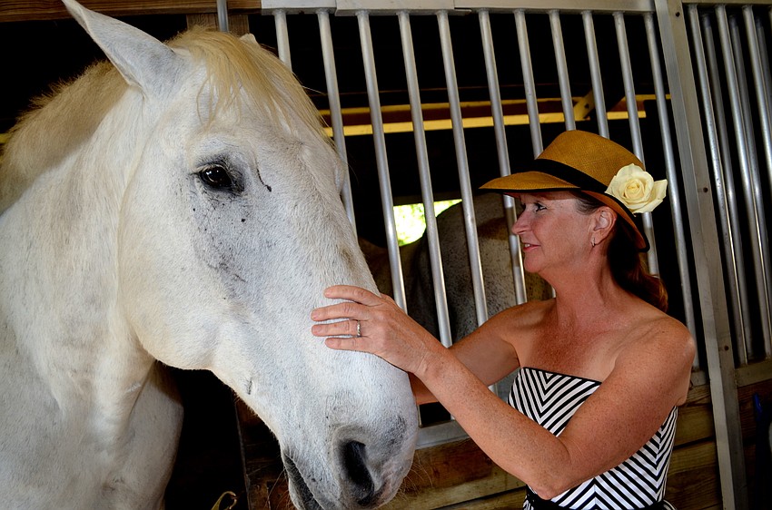 Sterling enjoys Julie Holt’s company in the barn.