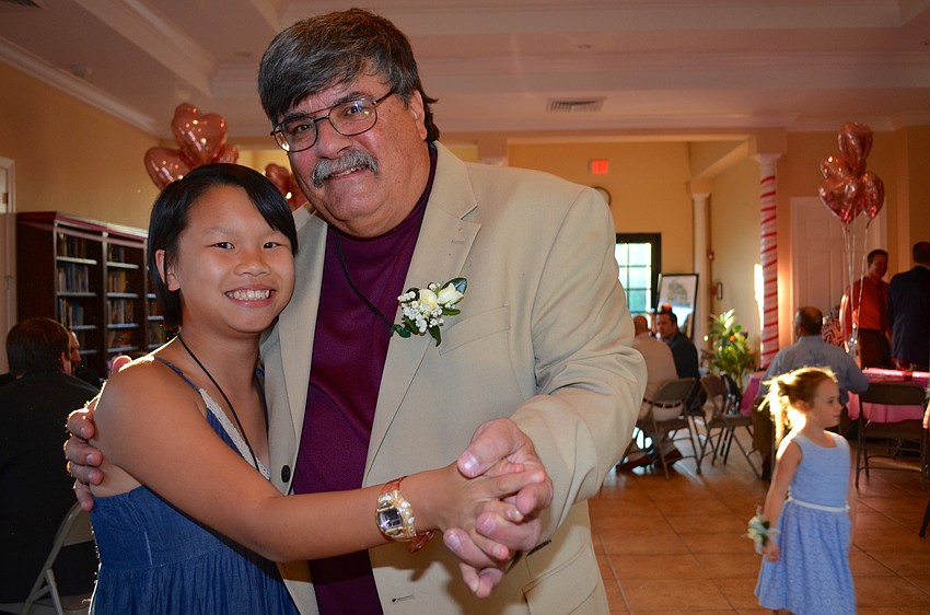 Tia Biribauer and her father, Richard, who was the DJ for the event,  were one of the first dancers on the floor.