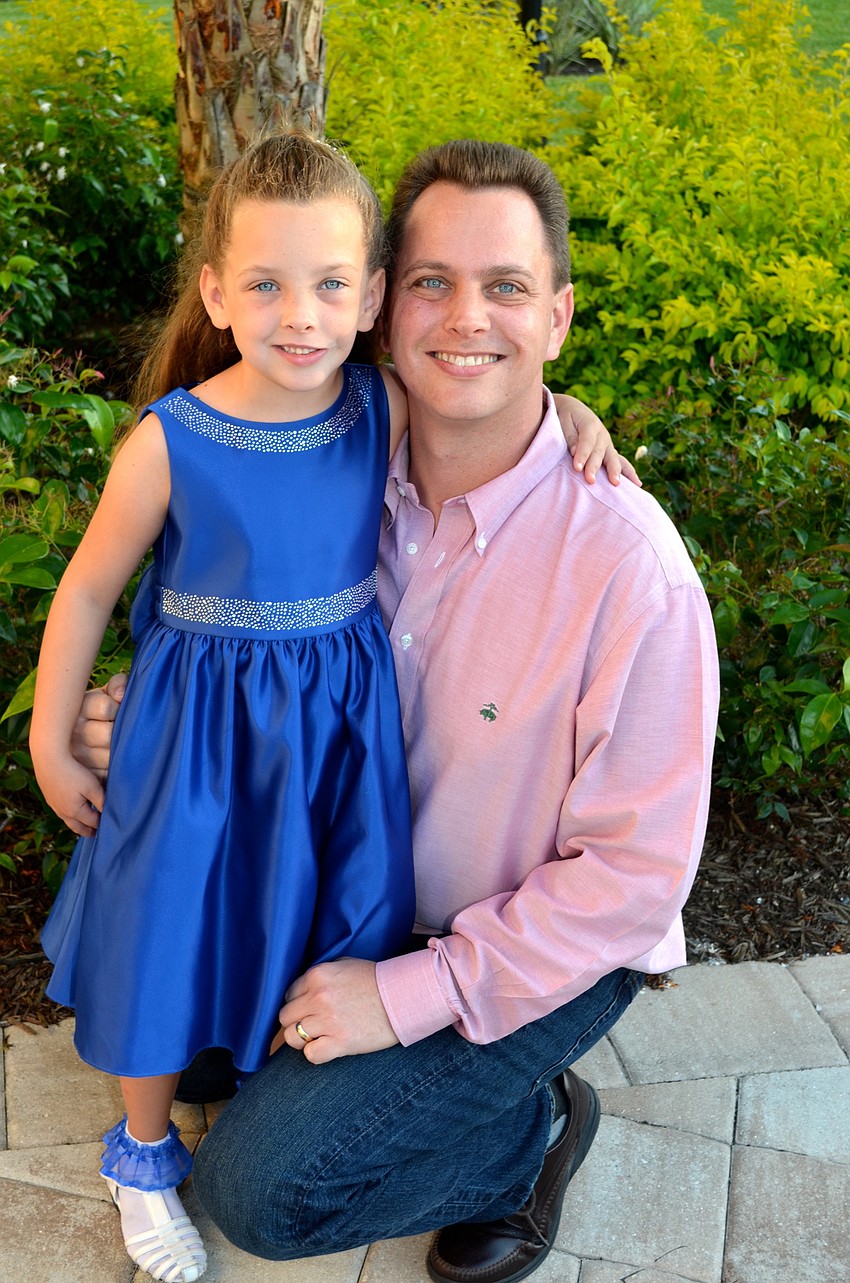 Kaitlyn Wolfe and her father, Jeff, are one of the first guests to arrive.