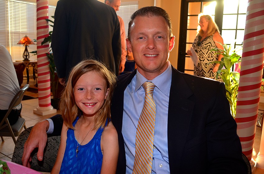 Hayley and Brian Roberts cozy up with friends.