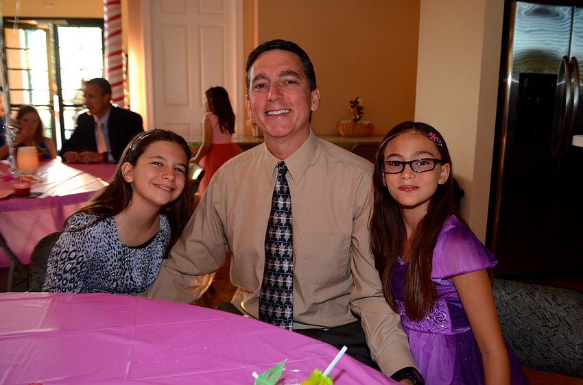 Jordan, Mike and Danielle Mantone relax with snacks before dancing.