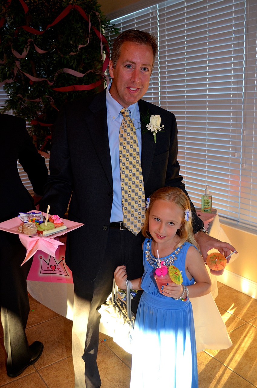 Doug and Makenna Wogan enjoy refreshments and snacks before dancing.