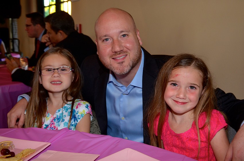 Geoff Springfield says cheese, flanked by his daughters, Courtney and Cristina.