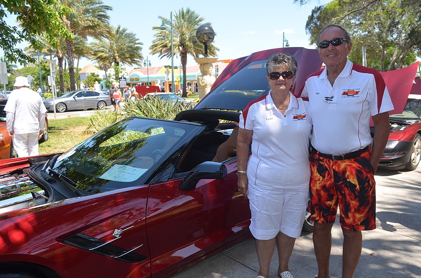 Lynn and Ray Lake with their 2014 crystal red coupe