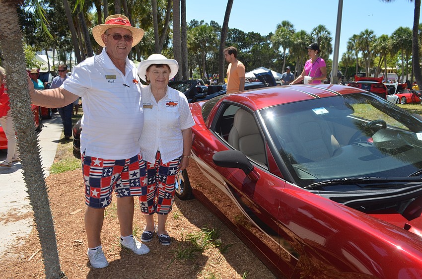 Bud and Mary Ellen Fisher with their 2007 red coupe