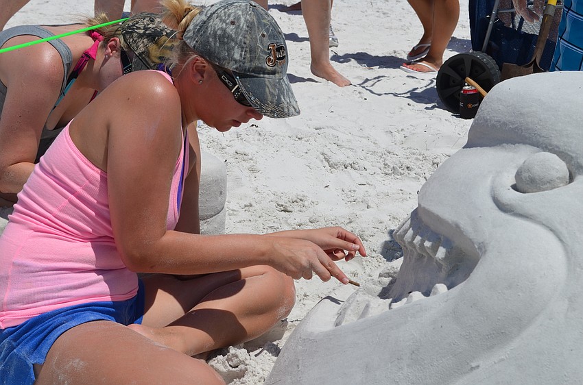 Holly Arey works on the menacing teeth for “Penguins are Friends Not Food.”