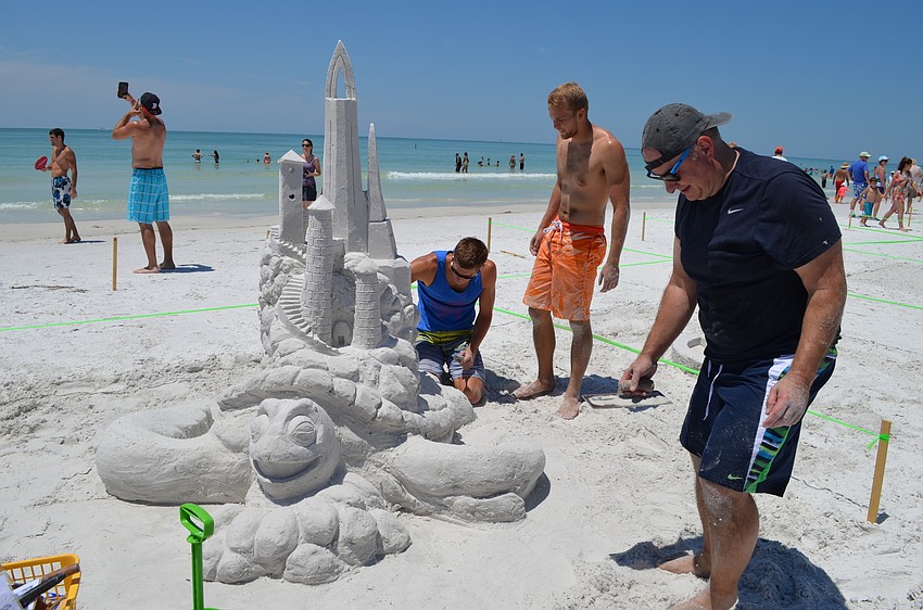 Justin and Alec Muklewicz inspect the castle they helped build with their father DaveMuklewicz.