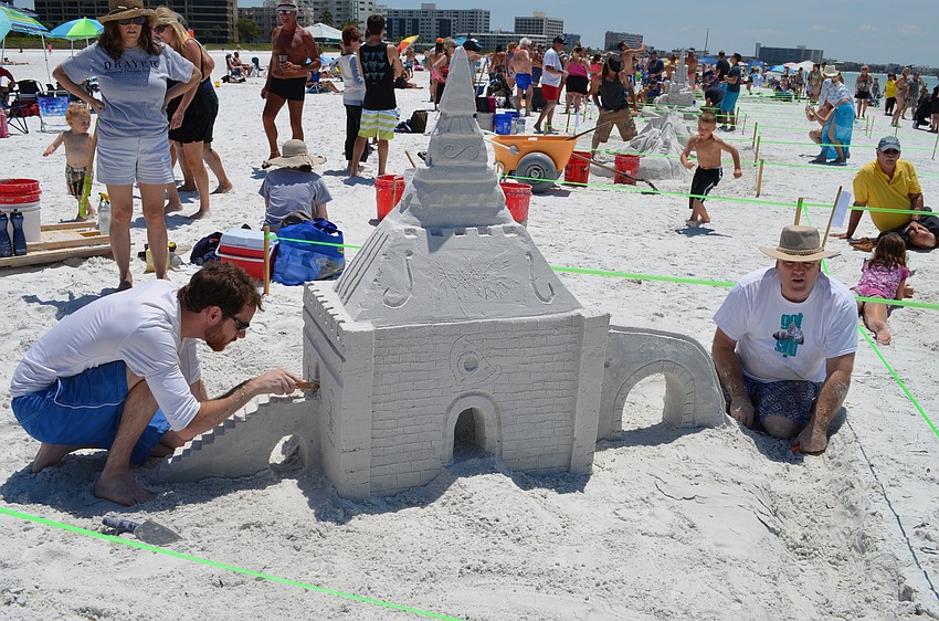 William Pratesi and Mike Bradley work on “Mickey’s Castle” that was inspired by family members who work at Disney World.