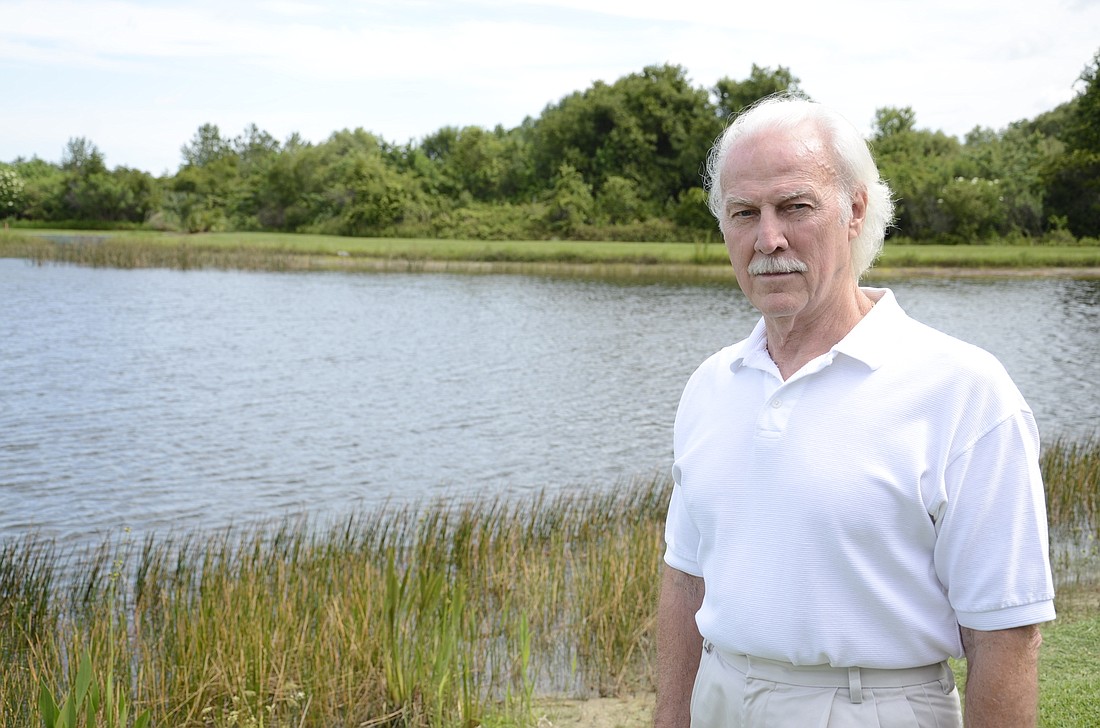 Ron Jarvis has spent years observing the alligators that have made their home in the pond behind his house. â€œItâ€™s neat to see alligators â€” theyâ€™re smarter than people think,â€ he said. Photo by Jessica Salmond