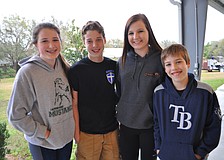 Sydney Hodgkinson, Thomas Alexander, Savannah Hodgkinson and Connor Alexander chat before dinner.