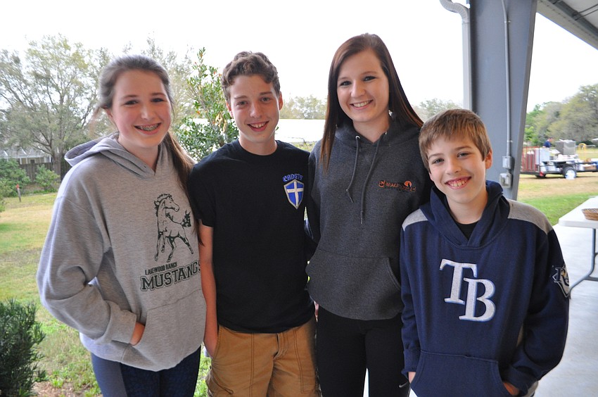 Sydney Hodgkinson, Thomas Alexander, Savannah Hodgkinson and Connor Alexander chat before dinner.