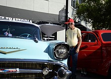 Ron Plank checks out the classic Chevy at Ed Tavern's car show.